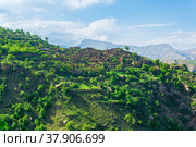Ruins of houses on a mountainside in Kurib, a depopulated village with the only remaining household with an apiary, Dagestan. Стоковое фото, фотограф Евгений Харитонов / Фотобанк Лори