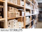 Decorative wooden jewelry storage caskets on shelves in store. Стоковое фото, фотограф Яков Филимонов / Фотобанк Лори