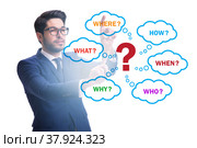Concept of many different questions asked with businessman. Стоковое фото, фотограф Elnur / Фотобанк Лори