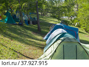 Lake Baikal in summer. Tourists often set up a camp near the fishing village of Uzury on the eastern shore of Olkhon Island on a hillside near Haga-Yaman Bay. Summer travel. Стоковое фото, фотограф Виктория Катьянова / Фотобанк Лори