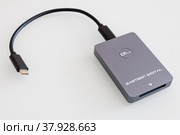 Cfexpress memory card reader isolated on white background (2022 год). Редакционное фото, фотограф Хилько Алексей / Фотобанк Лори