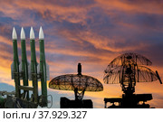 Air defense radars of military mobile anti aircraft systems and modern Russian anti-aircraft missiles OSA-AKM on the background of the sunset orange sky,Russia. Стоковое фото, фотограф Владимир Журавлев / Фотобанк Лори