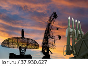 Air defense radars of military mobile anti aircraft systems and modern Russian anti-aircraft missiles OSA-AKM on the background of the sunset orange sky,Russia. Стоковое фото, фотограф Владимир Журавлев / Фотобанк Лори