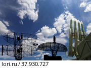 Air defense radars of military mobile anti aircraft systems and modern Russian anti aircraft missiles OSA-AKM on background clouds and sky,Russia. Стоковое фото, фотограф Владимир Журавлев / Фотобанк Лори
