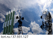 Air defense radars of military mobile anti aircraft systems and modern Russian anti aircraft missiles OSA-AKM on background clouds and sky,Russia. Стоковое фото, фотограф Владимир Журавлев / Фотобанк Лори