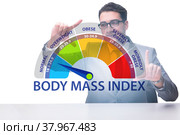 Concept of BMI - body mass index with nutritionist. Стоковое фото, фотограф Elnur / Фотобанк Лори