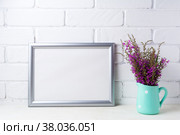 Silver landscape frame mockup with maroon purple flowers in mint pitcher. Стоковое фото, фотограф TasiPas / Фотобанк Лори