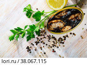 Marinated chipirones in ink with greens and lemon. Стоковое фото, фотограф Яков Филимонов / Фотобанк Лори