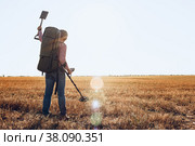 Man with metal detector equipment searching for metal goods in the field. Стоковое фото, фотограф Сергей Толмачёв / Фотобанк Лори