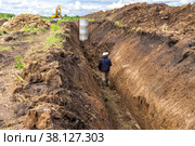 Executive geodetic survey of a sewer or water supply network, geodetic work during the laying of underground utilities. Стоковое фото, фотограф Дмитрий Коростылев / Фотобанк Лори