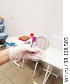 Krasnodar, Russia - November 23, 2021: a nurse holds in her hand vacuum tubes for collecting venous blood with an acti-fine coagulation activator. Редакционное фото, фотограф Андрей С / Фотобанк Лори