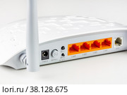 Connectors, control buttons. lan and adsl ports on a new white Wi Fi router with gray antennas on a white background close-up. Стоковое фото, фотограф Андрей С / Фотобанк Лори
