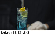 Glass of Blue Lagoon Cocktail. Стоковое видео, видеограф Татьяна Чудакова / Фотобанк Лори