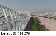 Meydan bridge in Dubai in cloudy afternoon. Стоковое видео, видеограф Aleksey Kidisyuk / Фотобанк Лори