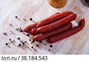 Appetizing tyrolean sausages on wooden table. Стоковое фото, фотограф Яков Филимонов / Фотобанк Лори