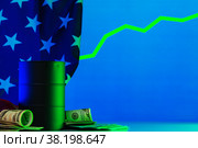 Price of american oil is changing concept. Black barrel with oil and graph. Стоковое фото, фотограф Сергей Толмачёв / Фотобанк Лори