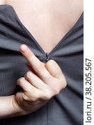 Young woman unzips the zipper on the dress. Hand showing fuck sign. Стоковое фото, фотограф Сергей Пристяжнюк (Serg Zastavkin) / Фотобанк Лори