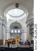 Smolny Cathedral interior with parishioners, Church utensils. Unique urban landscape center Saint Petersburg. Central historical sights city. Top tourist places in Russia. Capital Russian Empire (2017 год). Стоковое фото, фотограф Aleksandr Golubev / Фотобанк Лори