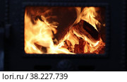 Wood burning stove is used at start of heating season in private house. Стоковое видео, видеограф Владимир Григорьев / Фотобанк Лори