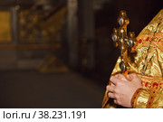 Rite of baptism golden cross in priest hands in orthodox church or temple for ceremony easter. Background cross easter in orthodox temples. Concept of church backgrounds for creativity. Copy space. Стоковое фото, фотограф Aleksandr Golubev / Фотобанк Лори