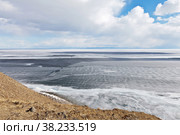 Baikal Lake in April day. View on the ice drift, debacle and melting of the ice cover. Beautiful spring landscape. Natural background. Change of seasons. Spring active outdoors and hike. Стоковое фото, фотограф Виктория Катьянова / Фотобанк Лори