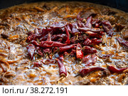 Острый перец в приготовлении плова. Узбекская кухня (2022 год). Стоковое фото, фотограф Анна Карасева / Фотобанк Лори