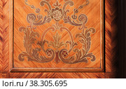 Decorative inlay carving pattern of vintage wooden wall panel. Стоковое фото, фотограф EugeneSergeev / Фотобанк Лори