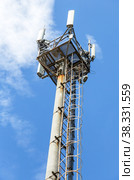 Telecommunication tower for mobile phone with antennas over a blue sky. Стоковое фото, фотограф FotograFF / Фотобанк Лори