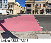 City pedestrian crossings are painted pink to draw attention to month of breast cancer awareness in October (2022 год). Редакционное фото, фотограф Kira_Yan / Фотобанк Лори