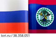 Национальные флаги Российской Федерации и Белиза крупным планом. Иллюстрация экономических, политических, культурных отношений (2021 год). Стоковое фото, фотограф Лозовая Людмила / Фотобанк Лори