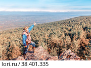 A man stands on a rock and opens his arms in breadth. Стоковое фото, фотограф Акиньшин Владимир / Фотобанк Лори