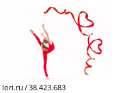 Isolated on white background girl gymnast exercising with red ribbon twisting hearts. Стоковое фото, фотограф Мария Мороз / Фотобанк Лори