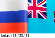 Национальные флаги Российской Федерации и Фиджи крупным планом. Иллюстрация экономических, политических, культурных отношений (2021 год). Стоковое фото, фотограф Лозовая Людмила / Фотобанк Лори