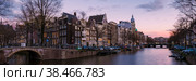 Amsterdam Netherlands canals with lights during evening in December during winter in the Netherlands. Стоковое фото, фотограф Fokke Baarssen / Фотобанк Лори