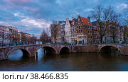 Amsterdam Netherlands canals with lights during evening in December during winter in the Netherlands. Стоковое фото, фотограф Fokke Baarssen / Фотобанк Лори
