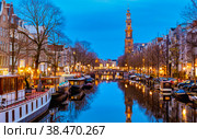 Amsterdam Netherlands canals with lights during evening in December during winter in the Netherlands. Стоковое фото, фотограф Fokke Baarssen / Фотобанк Лори