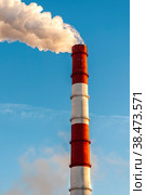 The pipe of the thermal power plant on the background of the blue sky. The concept of ecology and environmental protection. Стоковое фото, фотограф Ярославский Максим / Фотобанк Лори