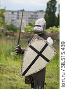 KALININGRAD, RUSSIA - JUNE 17, 2012, the man in a suit of the Teutonic knight on knightly tournament "Royal mountain" on June 17, 2012 in Kaliningrad, Russia. Редакционное фото, фотограф Lekcej / Фотобанк Лори
