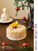 Napoleon cake. Fir branches, cones, candles, side view, wooden background. Стоковое фото, фотограф Лютик Фалисова / Фотобанк Лори