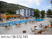 Pam Hotel, view from the courtyard. Pool and restaurant tables. Thermal balneotherapy, hotel (2019 год). Редакционное фото, фотограф Леонид Еремейчук / Фотобанк Лори