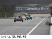 11-20-2022 PORTUGAL, LISBON: Caterham festival - racing karts with advertising stickers on the back driving in a row on the track. Редакционное фото, фотограф Константин Шишкин / Фотобанк Лори