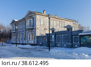IRKUTSK, RUSSIA -January 01, 2023: View on wooden Volkonsky Manor House - famous Historical and Memorial Museum of the Decembrists at winter cold sunny day. Редакционное фото, фотограф Виктория Катьянова / Фотобанк Лори