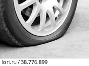 Flat tire on the car. Silver forged wheel. Close up. Стоковое фото, фотограф Плотников Дмитрий / Фотобанк Лори