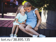 beautiful young girls sit on the veranda and chat. Стоковое фото, фотограф Поликарпов Владимир Владимирович / Фотобанк Лори