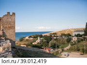 The medieval fortress of Kafa on the shore of the Gulf of Feodosia. View of the temple of the Iver Icon of the Mother of God. (2015 год). Редакционное фото, фотограф Photojuli / Фотобанк Лори