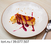 Slice of delicious cake with cheese mousse with blueberry topping on plate. Spanish dessert tarta de queso con arandano. Стоковое фото, фотограф Яков Филимонов / Фотобанк Лори