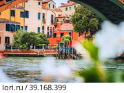 Old ancient facades of houses on Grand Canal, Venice, Italy. Vintage historical architecture buildings of Venice on water in summer season (2019 год). Стоковое фото, фотограф Igor Tichonow / Фотобанк Лори