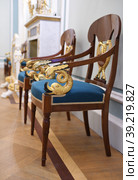 Gavrila Derzhavin Estate Museum in St. Petersburg, Russia. Extraordinary gold-plated fairy dolphins adorn smart armchairs (2023 год). Редакционное фото, фотограф Валерия Попова / Фотобанк Лори