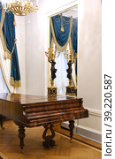 Gavrila Derzhavin Estate Museum in St. Petersburg, Russia. Antique brown grand piano in Ballroom (Great Hall) (2023 год). Редакционное фото, фотограф Валерия Попова / Фотобанк Лори