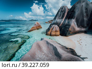 Granite rocks boulders at the best-known Anse Source d'Argent beach on island La Digue in Seychelles. Exotic paradise scenery. Стоковое фото, фотограф Igor Tichonow / Фотобанк Лори